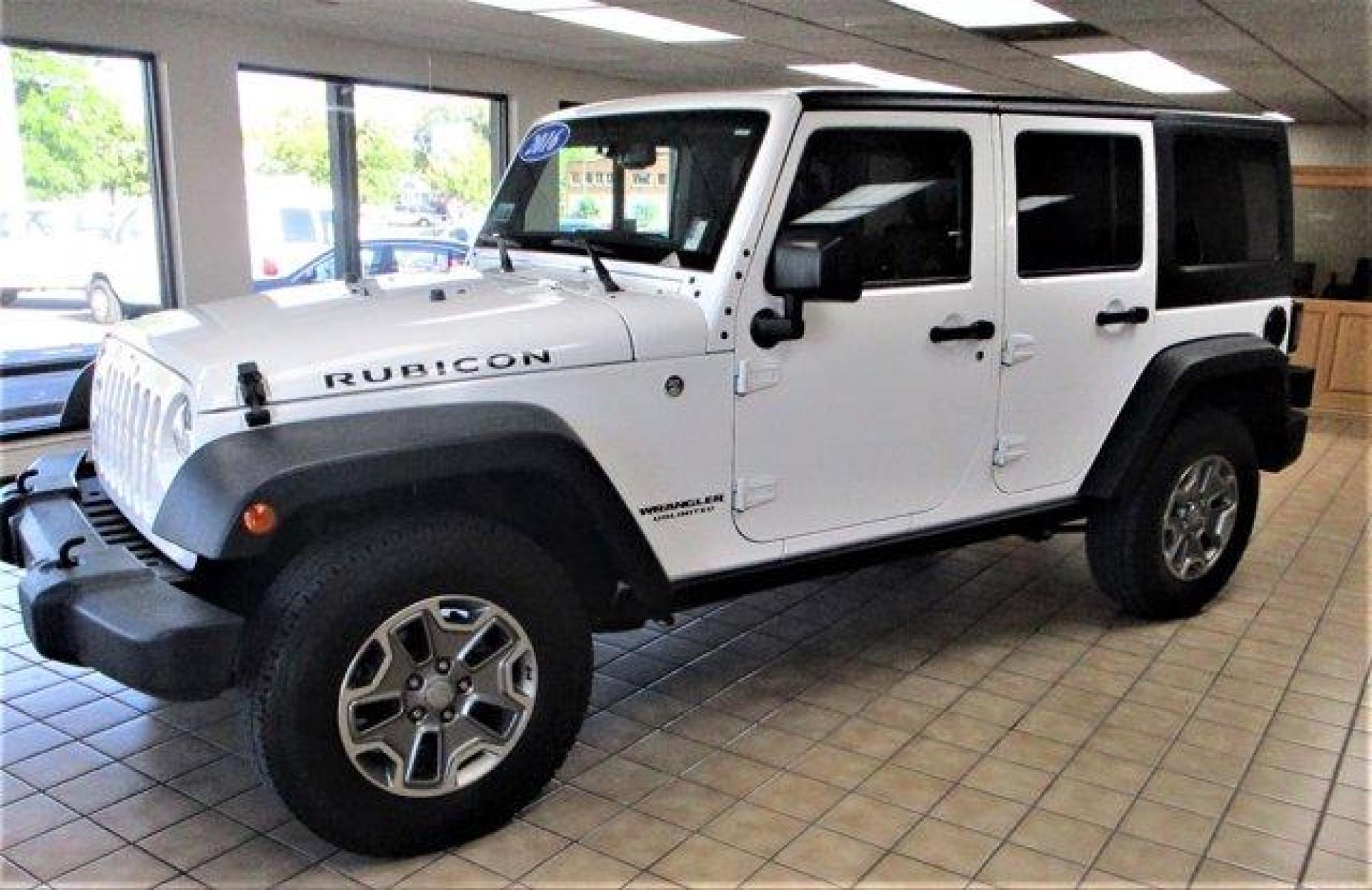 2016 Bright White Clearcoat /Black Jeep Wrangler Unlimited (1C4BJWFGXGL) with an 6 3.6 L engine, Automatic transmission, located at 3240 Washington Blvd., Ogden, 84401, (801) 621-7177, 41.204967, -111.969994 - 2016 Jeep Wrangler Unlimited Rubicon*Sherm's Store is Excited to Offer this Clean Title, **No **Accident **History **Jeep **Rubicon to New, and Repeat Customers.*Including: Heated Leather Upholstery, Exceptional Condition, Well Maintained,Clean Feel and Comfortable Ride!Additional:MOPAR PREMIUM SOUN - Photo #0