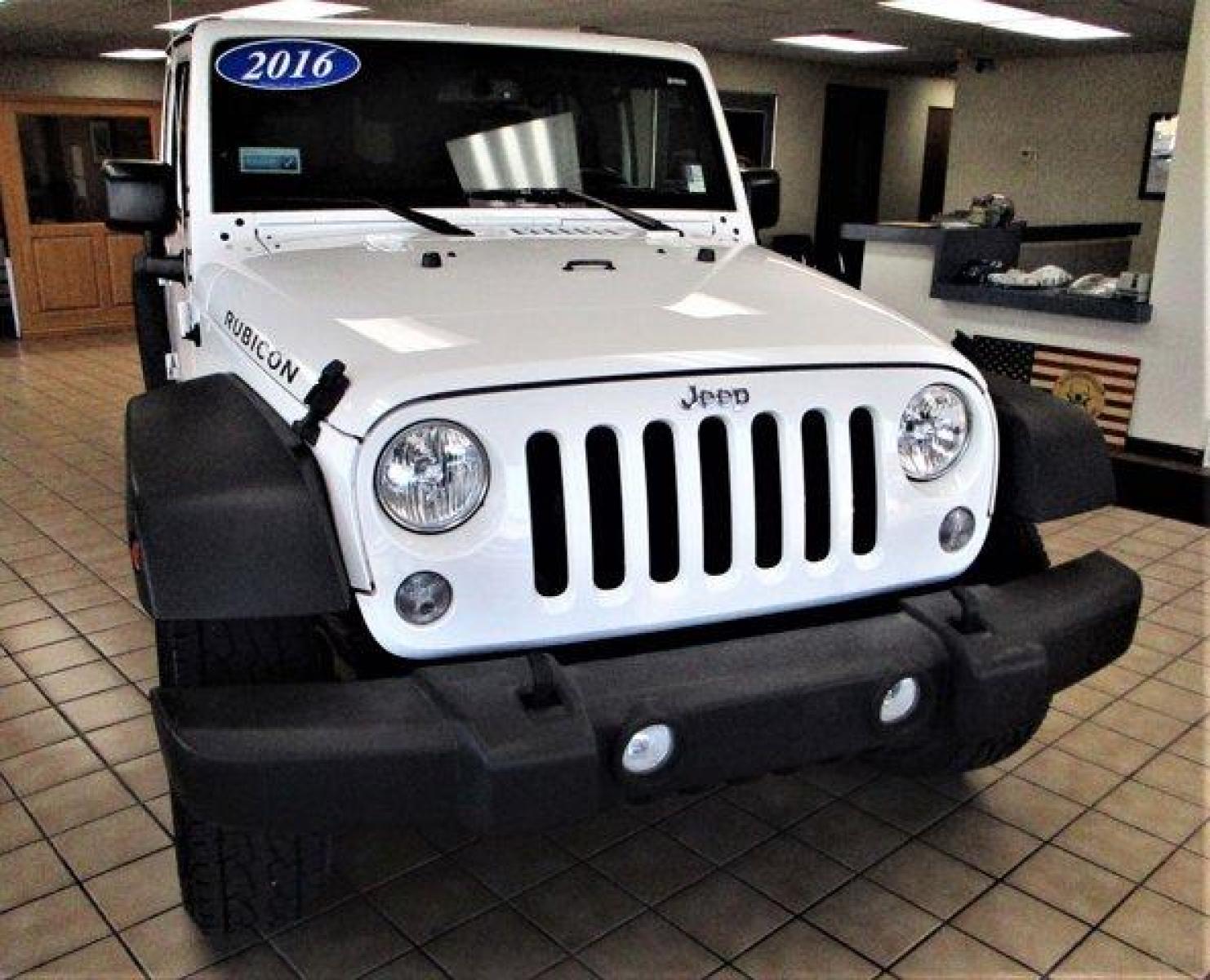 2016 Bright White Clearcoat /Black Jeep Wrangler Unlimited (1C4BJWFGXGL) with an 6 3.6 L engine, Automatic transmission, located at 3240 Washington Blvd., Ogden, 84401, (801) 621-7177, 41.204967, -111.969994 - 2016 Jeep Wrangler Unlimited Rubicon*Sherm's Store is Excited to Offer this Clean Title, **No **Accident **History **Jeep **Rubicon to New, and Repeat Customers.*Including: Heated Leather Upholstery, Exceptional Condition, Well Maintained,Clean Feel and Comfortable Ride!Additional:MOPAR PREMIUM SOUN - Photo #3