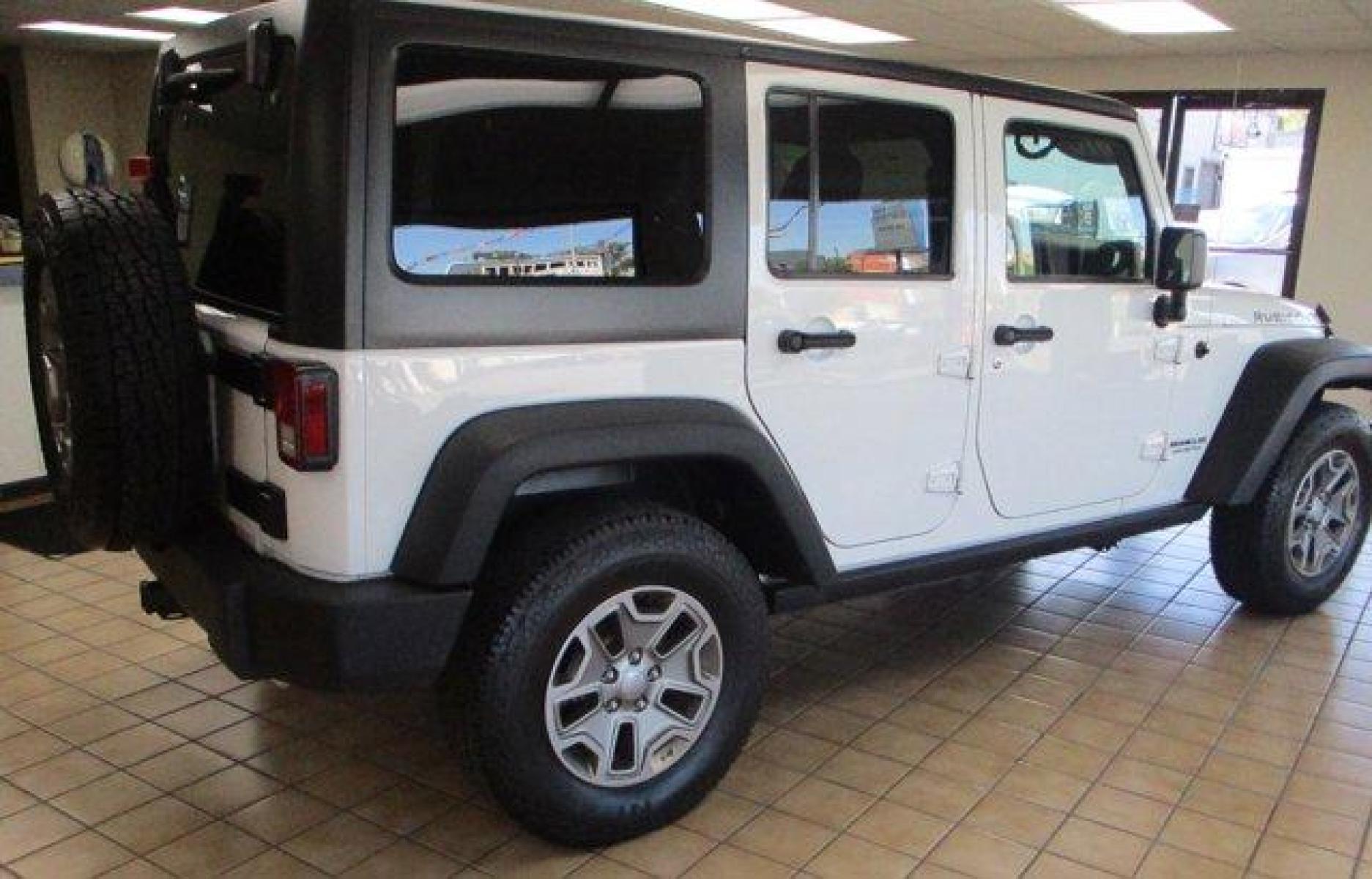 2016 Bright White Clearcoat /Black Jeep Wrangler Unlimited (1C4BJWFGXGL) with an 6 3.6 L engine, Automatic transmission, located at 3240 Washington Blvd., Ogden, 84401, (801) 621-7177, 41.204967, -111.969994 - Photo #4
