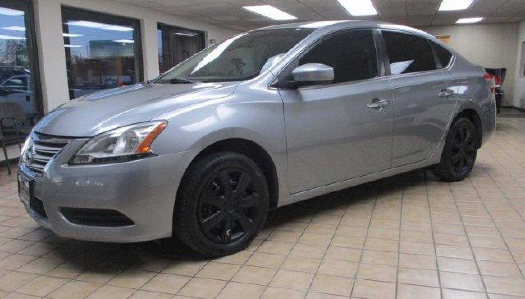 2014 Nissan Sentra (3N1AB7AP9EY) with an 4 1.8 L engine, Variable transmission, located at 3240 Washington Blvd., Ogden, 84401, (801) 621-7177, 41.204967, -111.969994 - *YOU FOUND IT !!! $7,988 LOOKIE AT THIS*Do you need a dependable car with good gas mileage for under TEN Grand and are having a hard time finding anything that's not wore right out? You might consider this good looking Nissan Sentra SV. 30 city and 38 highway mpg and only 107,635 miles.Sherm's Store - Photo #0
