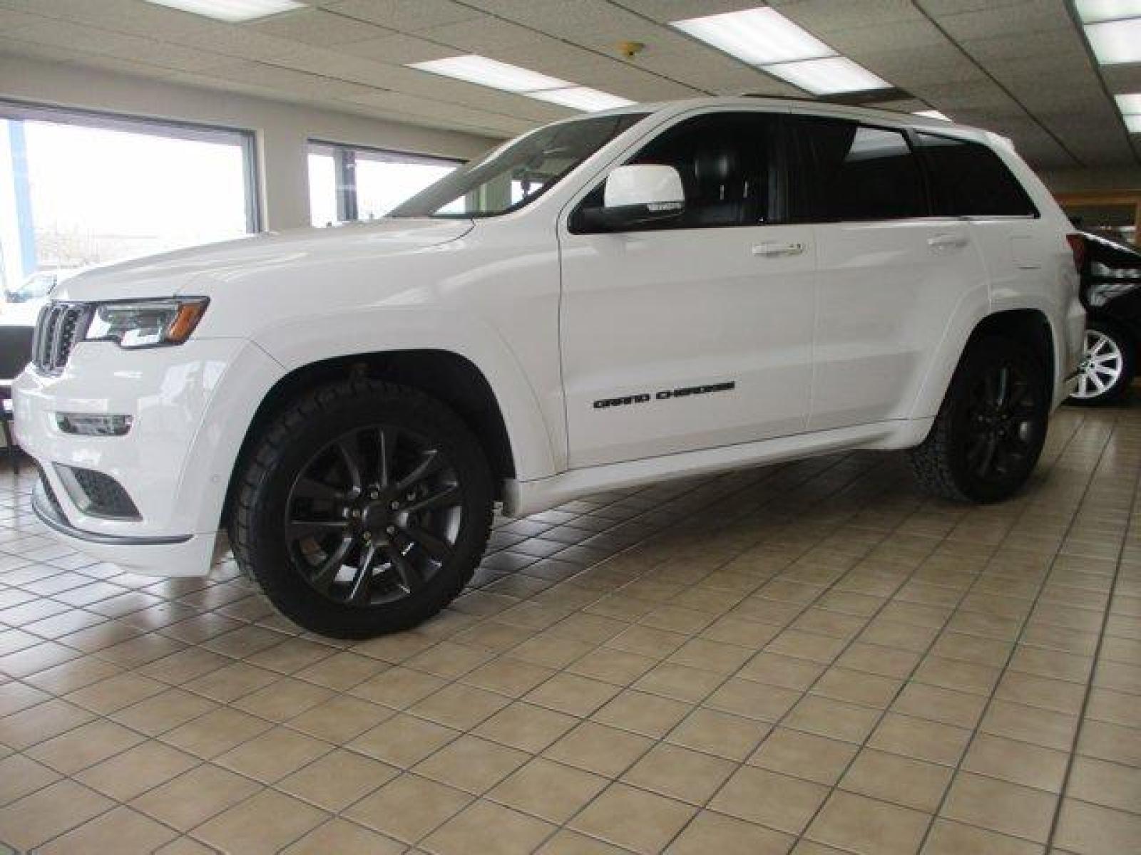 2018 Bright White Clearcoat /Black Jeep Grand Cherokee (1C4RJFCTXJC) with an 8 5.7 L engine, Automatic transmission, located at 3240 Washington Blvd., Ogden, 84401, (801) 621-7177, 41.204967, -111.969994 - Looking for a fully loaded Grand Cherokee with low mileage. Snap, this could be it. The High Altitude is Jeep's high end package and this one has it all. Full panoramic sunroof, huge back up camera, heated steering wheel and heated leather memory seats. Power passenger seat. Adaptive cruise control. - Photo #0