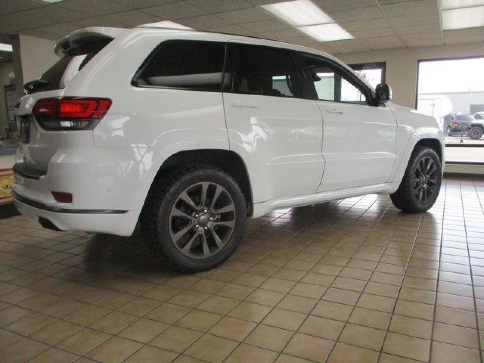 2018 Bright White Clearcoat /Black Jeep Grand Cherokee (1C4RJFCTXJC) with an 8 5.7 L engine, Automatic transmission, located at 3240 Washington Blvd., Ogden, 84401, (801) 621-7177, 41.204967, -111.969994 - Looking for a fully loaded Grand Cherokee with low mileage. Snap, this could be it. The High Altitude is Jeep's high end package and this one has it all. Full panoramic sunroof, huge back up camera, heated steering wheel and heated leather memory seats. Power passenger seat. Adaptive cruise control. - Photo #4