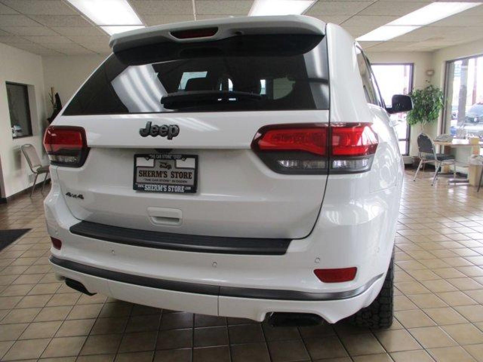2018 Bright White Clearcoat /Black Jeep Grand Cherokee (1C4RJFCTXJC) with an 8 5.7 L engine, Automatic transmission, located at 3240 Washington Blvd., Ogden, 84401, (801) 621-7177, 41.204967, -111.969994 - Looking for a fully loaded Grand Cherokee with low mileage. Snap, this could be it. The High Altitude is Jeep's high end package and this one has it all. Full panoramic sunroof, huge back up camera, heated steering wheel and heated leather memory seats. Power passenger seat. Adaptive cruise control. - Photo #5